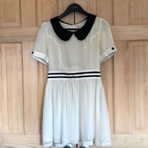 White lined sailor dress with Peter Pan collar.